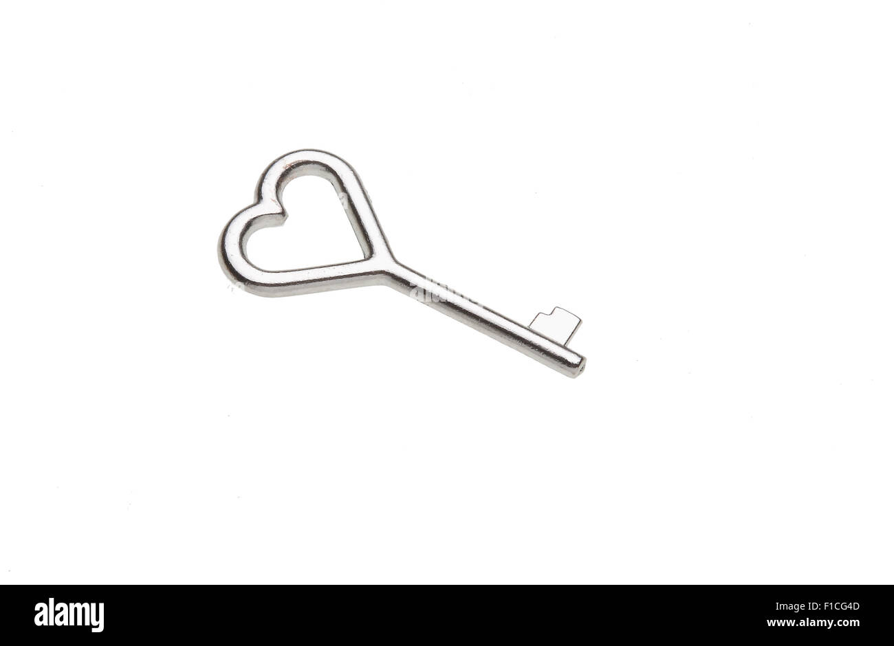 tiny key with a heart-shaped handle, Love lock Stock Photo