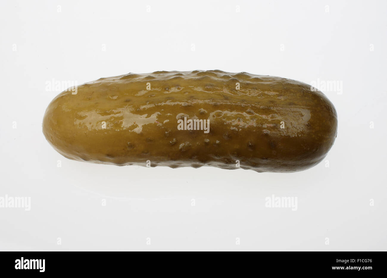 pickled cucumber or sour gherkin over white Stock Photo - Alamy