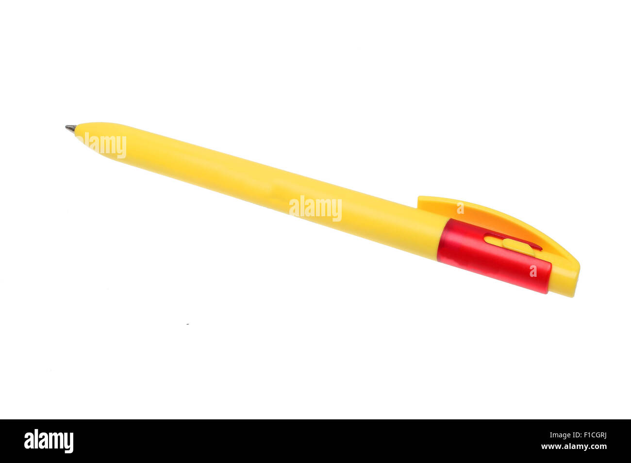 a yellow ball point pen over white Stock Photo