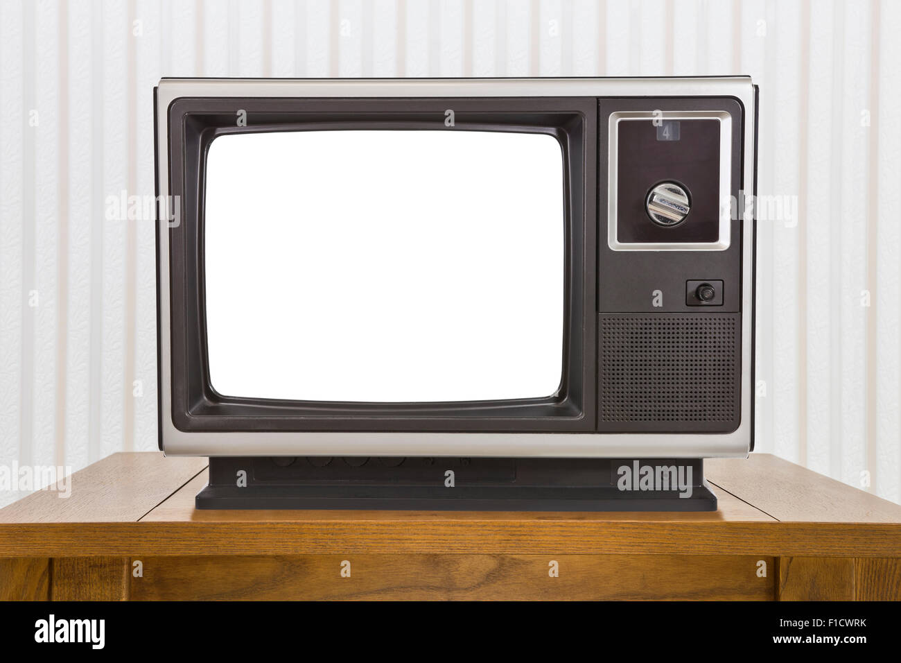 Old analogue portable television on table with cut out screen. Stock Photo