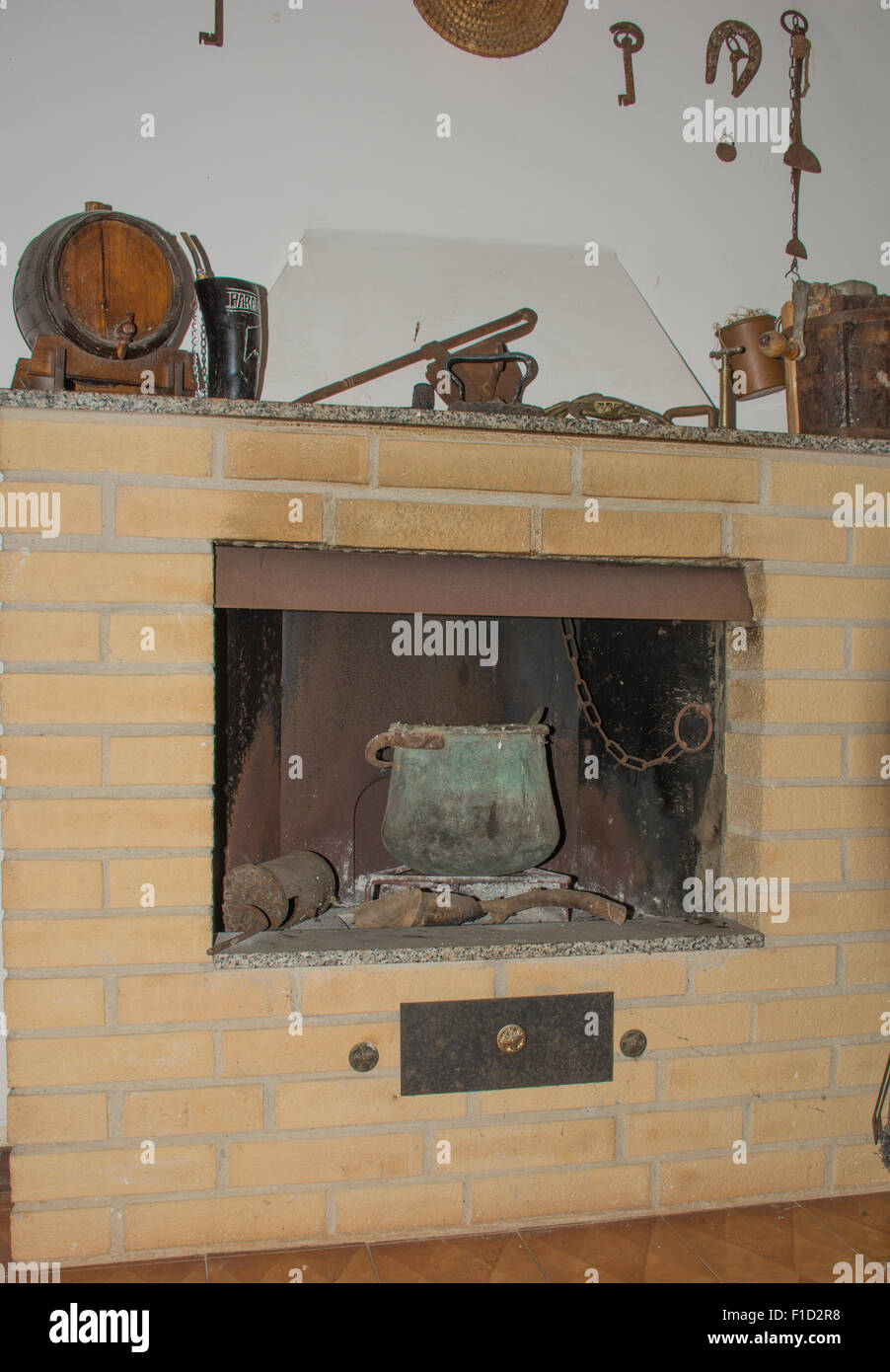 Old Fireplace Of A Country House Inside An Old Copper Pot With