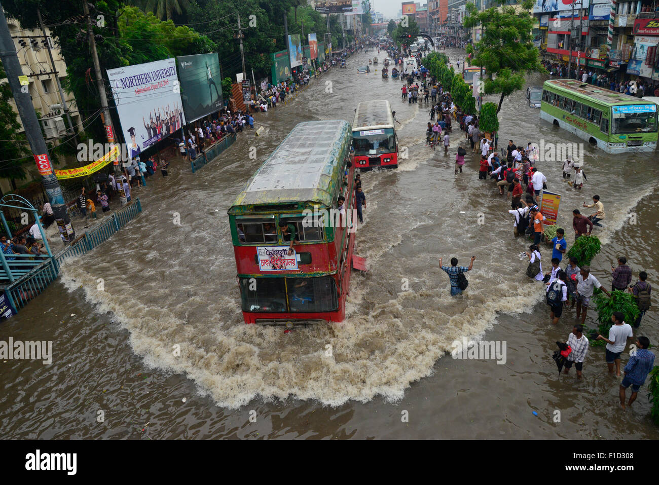 Dhaka, Bangladesh. 1st September, 2015. Vehicles try driving through the flooded Dhaka streets in Bangladesh. On September 1, 2015  Heavy monsoon downpour caused extreme flooding in most areas of Dhaka city, Bangladesh. Roads were submerged making travel slow and harmful. Credit:  Mamunur Rashid/Alamy Live News Stock Photo