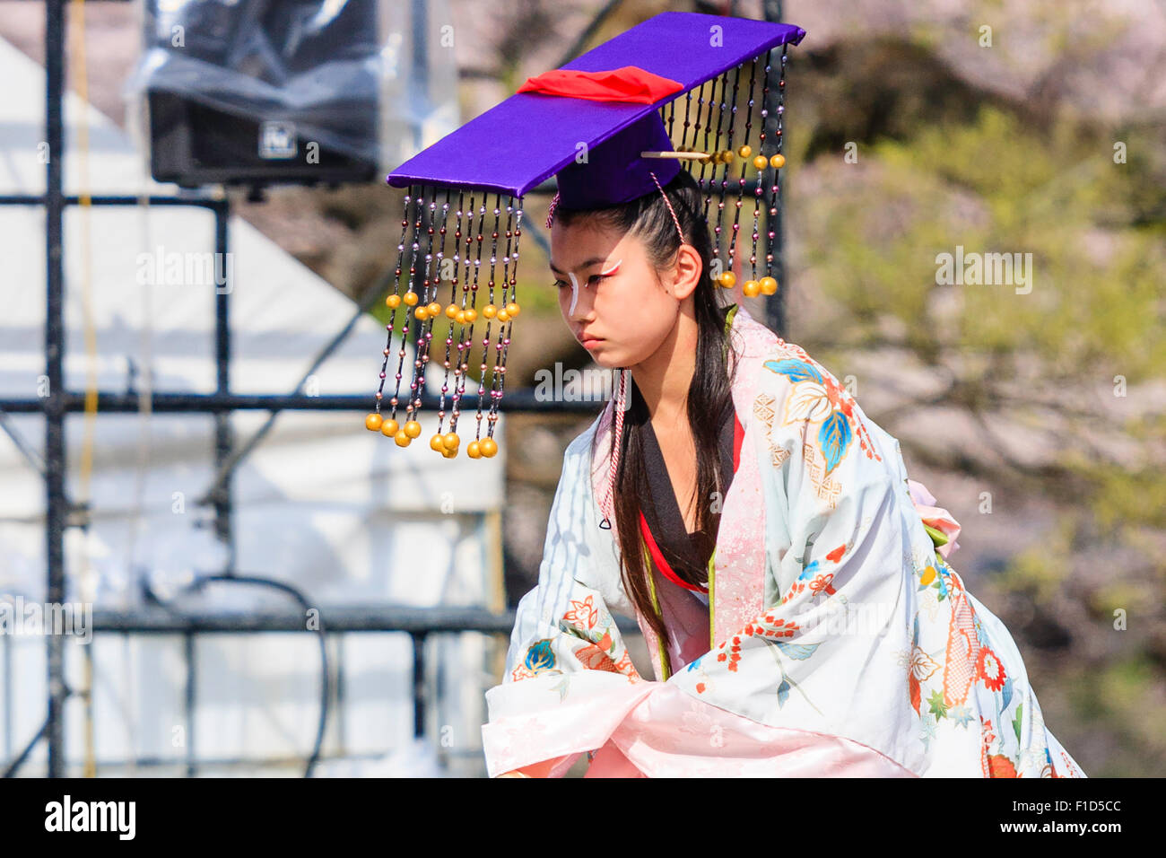 Kumamoto, Japan, Hinokuni Yosakoi Dance Festival. Dance troupe, girl dressed as princess bowing on stage Stock Photo
