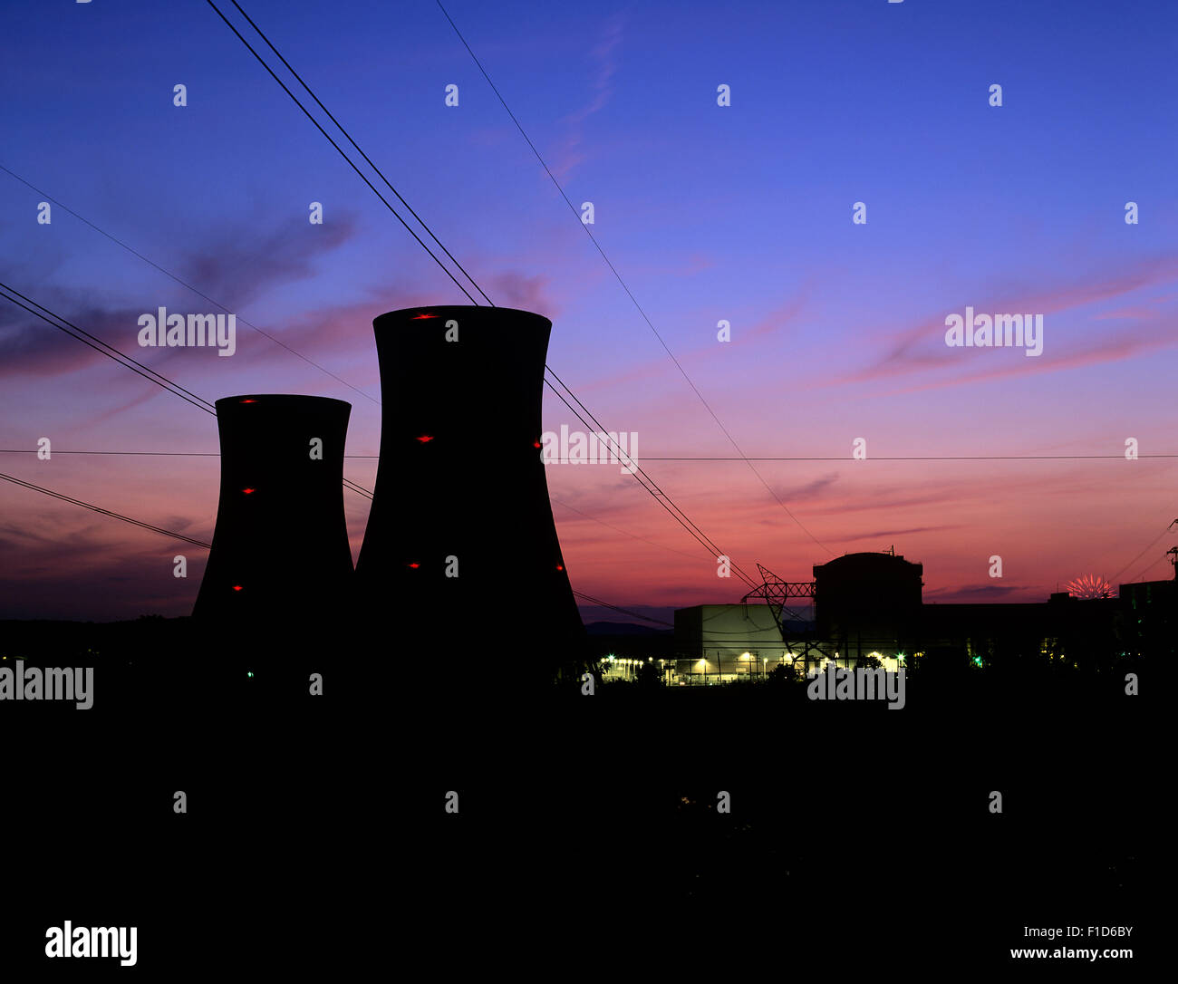 Twilight and the cooling towers of Three Mile Island nuclear power plant Unit 2, closed since 1979 after a fire in the reactor. Stock Photo