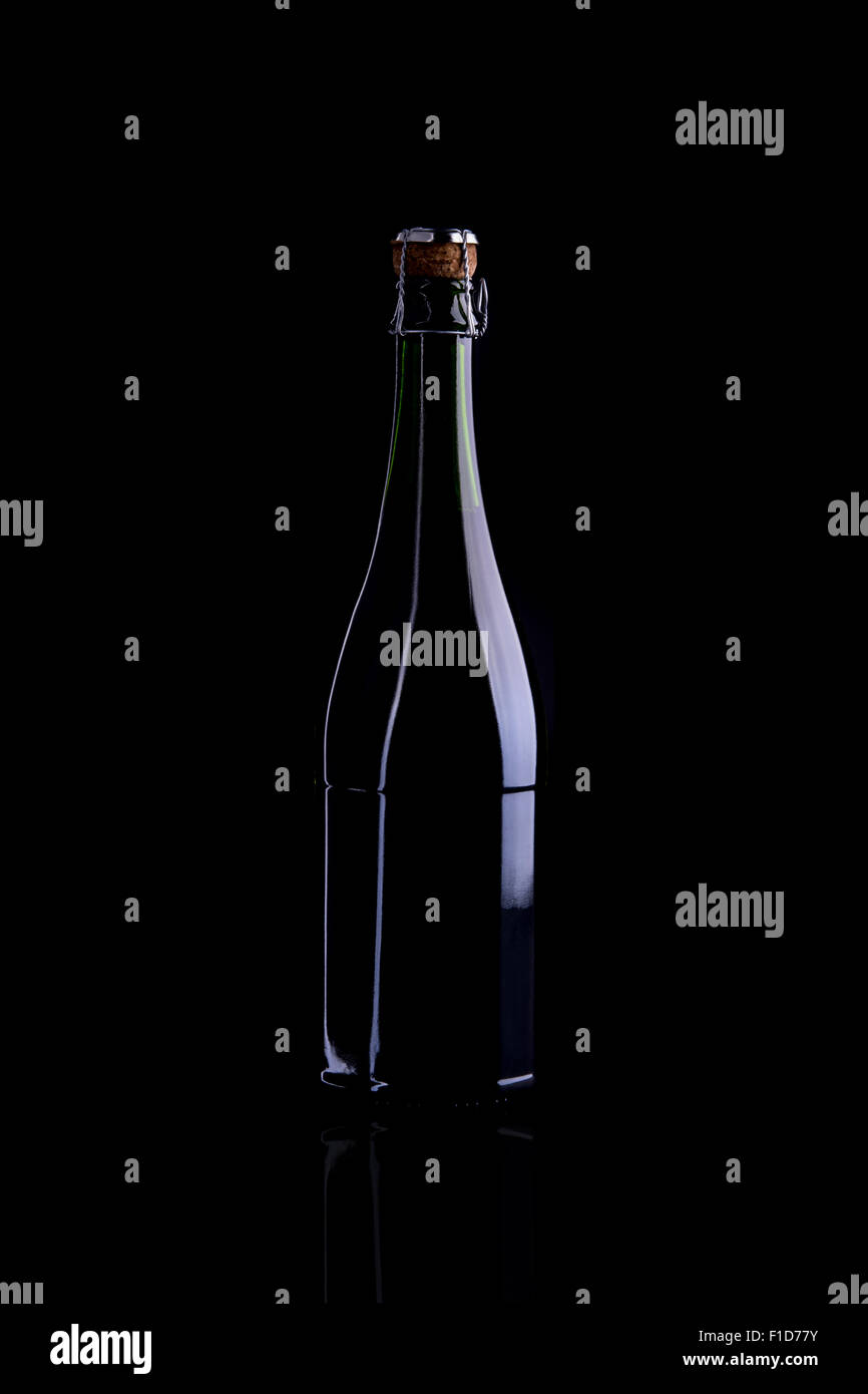 Wine bottle, still life profile, isolated on black background Stock Photo