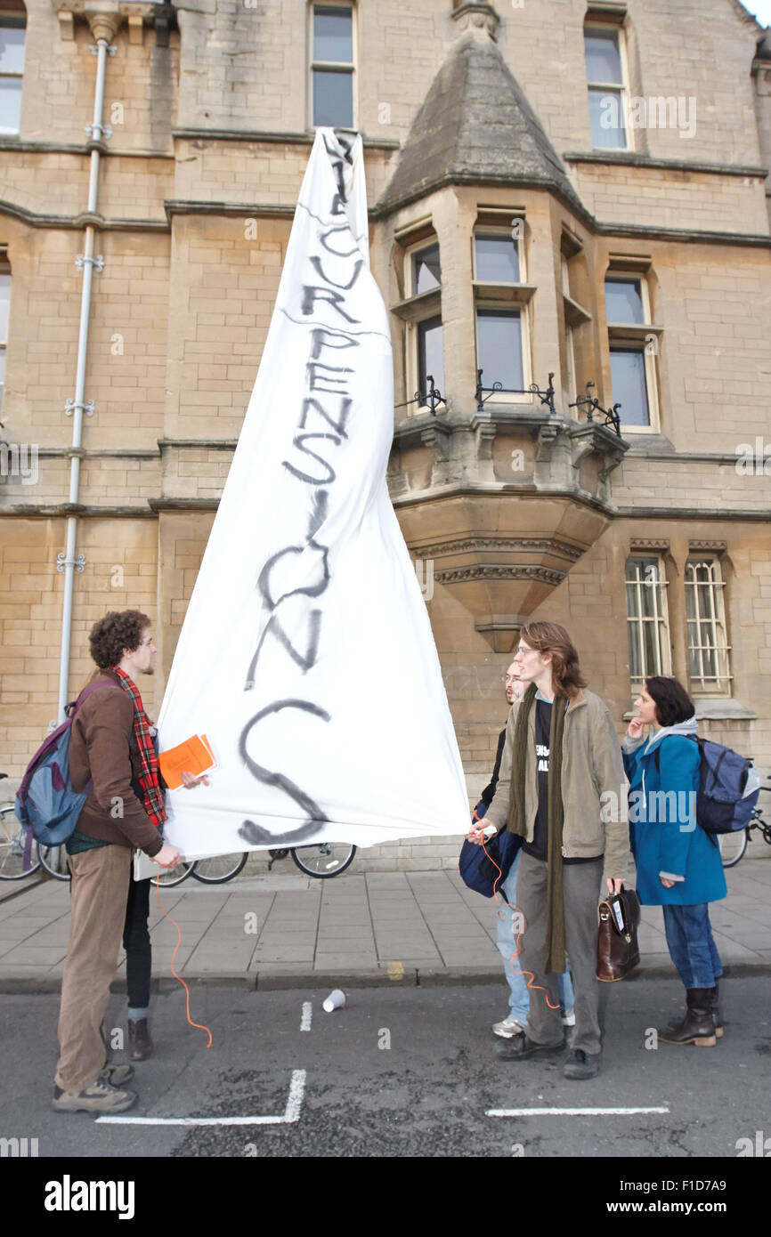 Students hang a banner reading 'Save our pensions' from a window in Balliol College as part of the n30 public sector strike Stock Photo