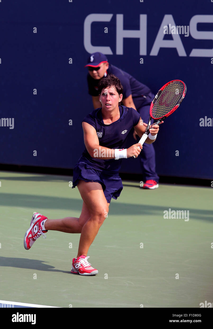 Spain's Carla Suarez Navarro, the number 10 seed, runs down a backhand against Czeckeslovakia's Denisa Allertova during the first round of the U.S. Open in Flushing Meadows, New York on Monday, August 31st.  Allertova won the match. Stock Photo