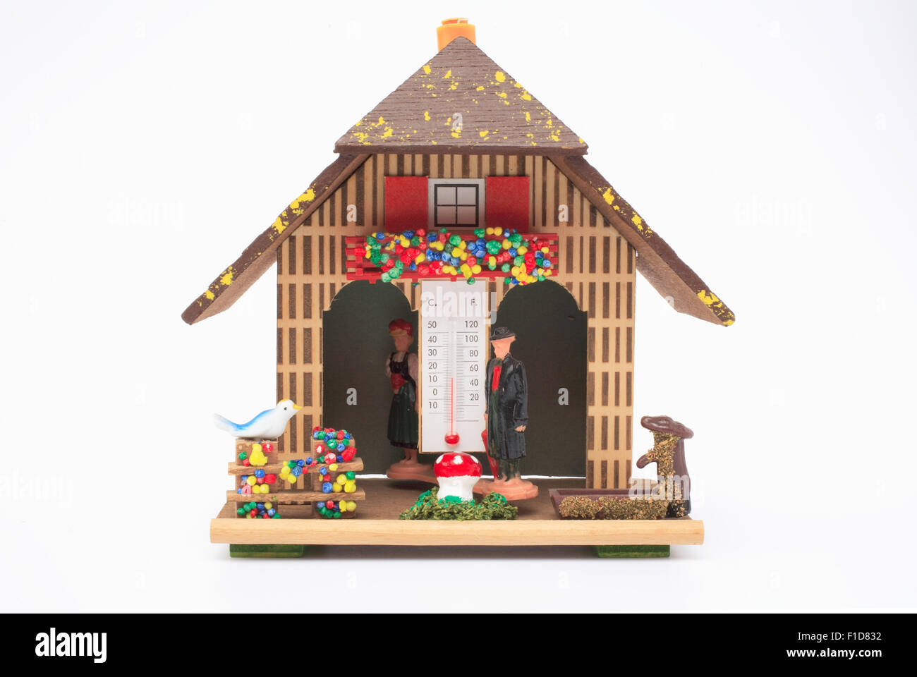 Weather house in a rainy position Stock Photo Alamy