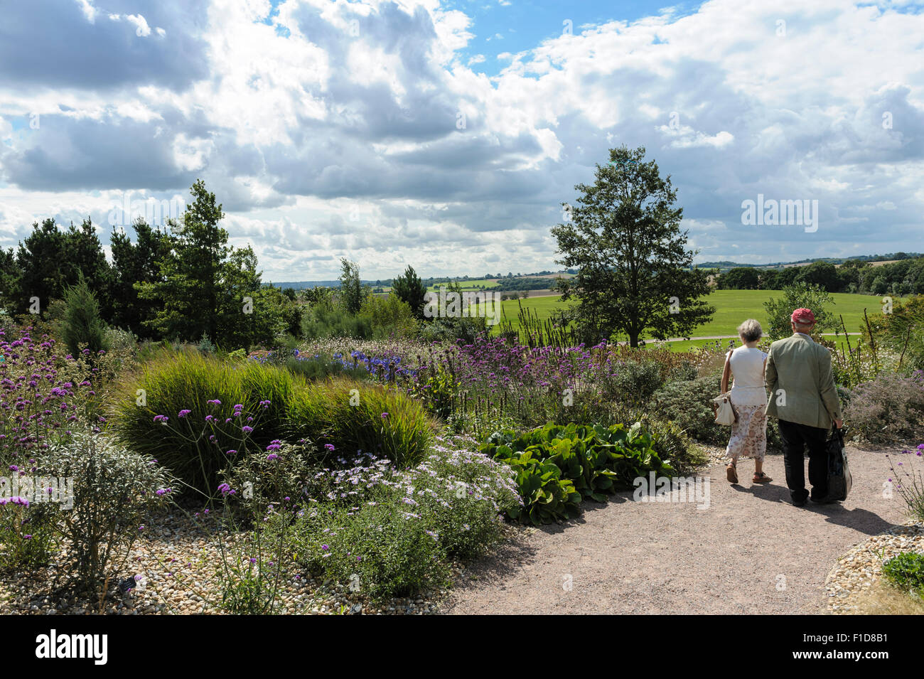 R.H.S Hyde Hall. A couple enjoy the dry garden and surrounding countryside. Stock Photo