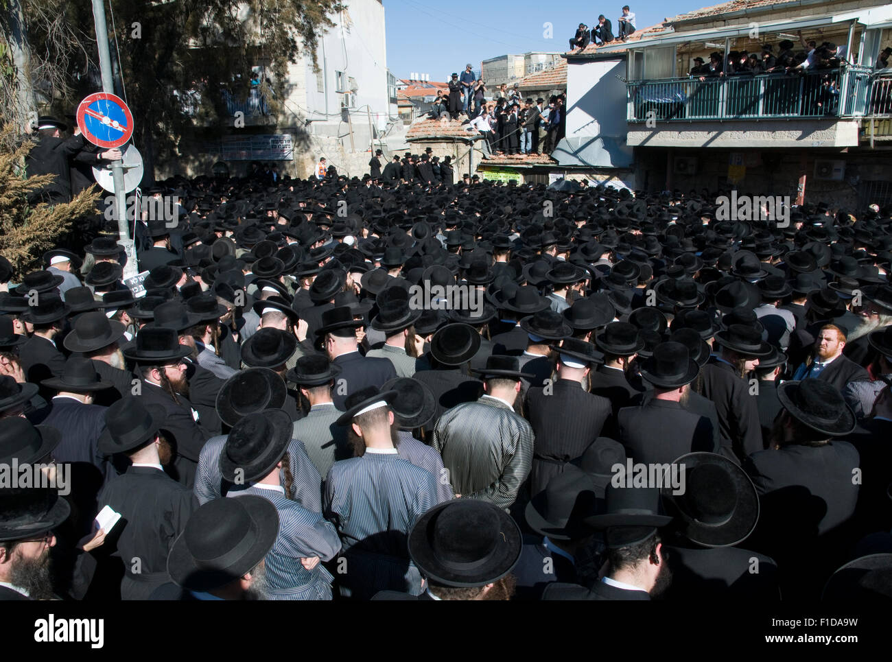 crowd of ultra orthodox Jews during a funeral ceremony. Mea Shearim neighborhood. Jerusalem, Israel. Stock Photo