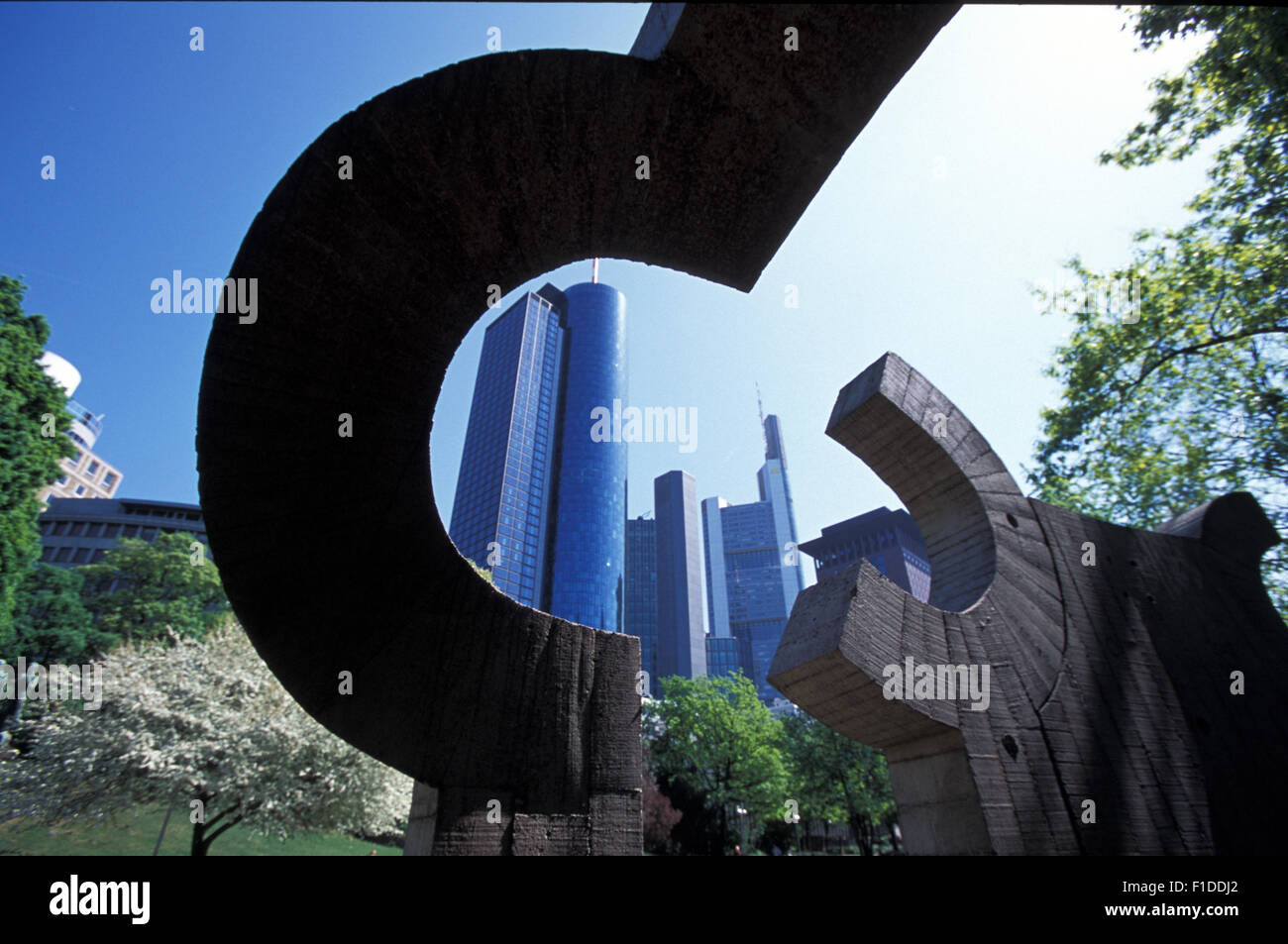 Ein Haus für Goethe sculpture by Eduardo Chillida in Frankfurt with Main Tower and Commerzbank skyscrapers in Frankfurt am Main Stock Photo