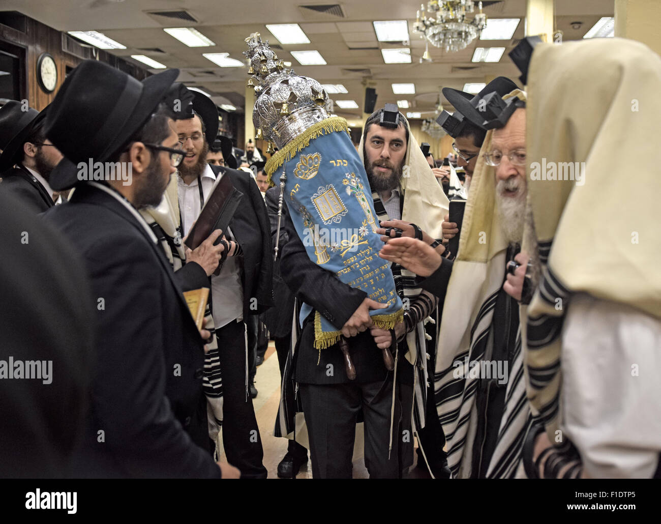 The Torah as it is returned to the Holy Ark after its reading at during morning synagogue services in Brooklyn, NYC Stock Photo