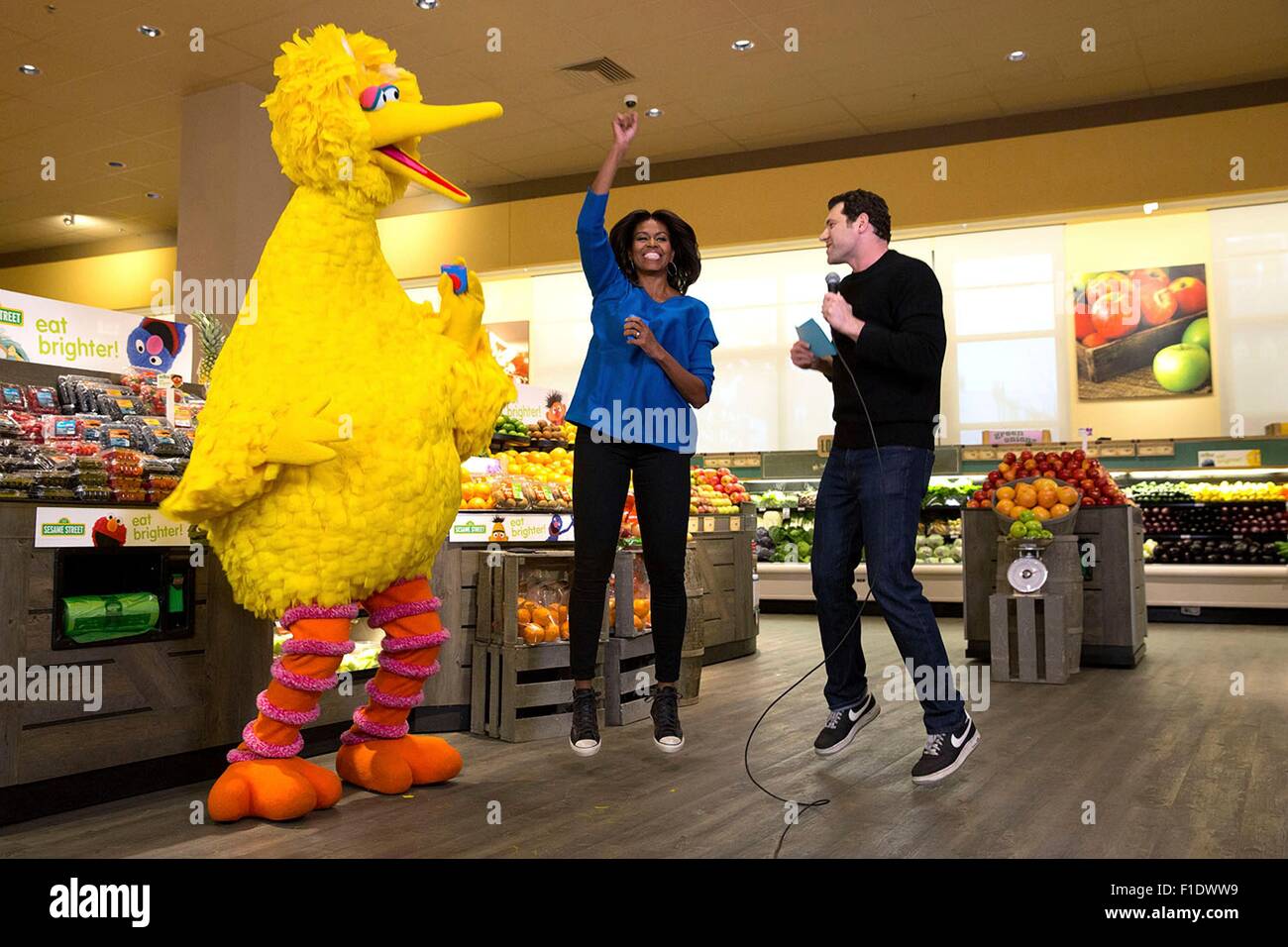 U.S. First Lady Michelle Obama participates in a Let's Move! Funny or Die game show taping with Billy Eichner of Billy on the Street and Big Bird at Safeway supermarket January 12, 2015 in Washington, D.C. Stock Photo
