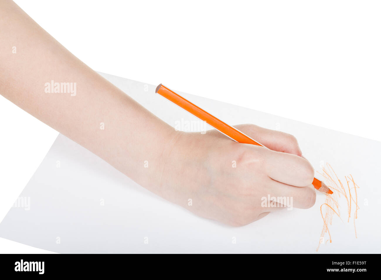 hand paints by orange pencil on sheet of paper isolated on white ...