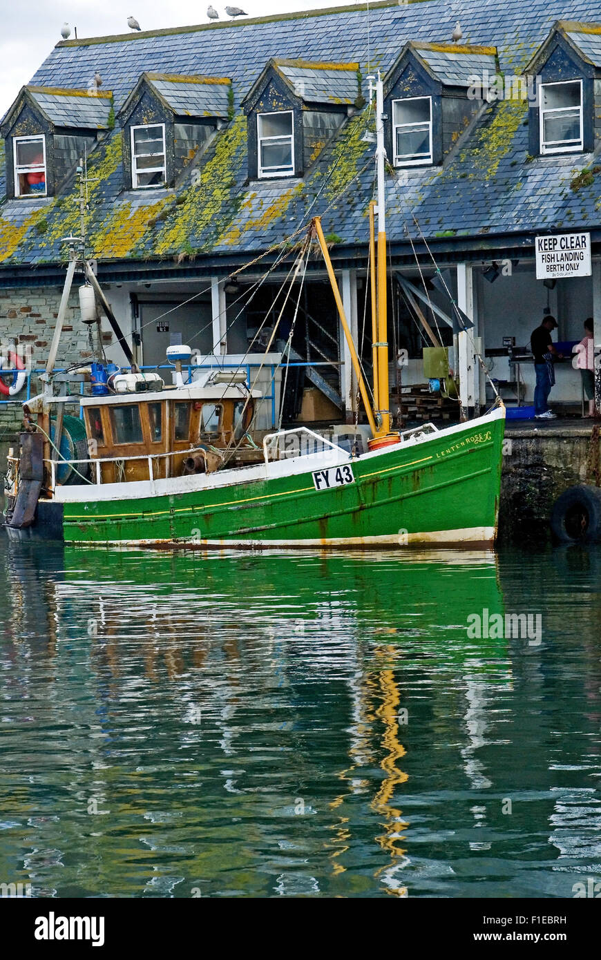Cornwall coast line and the fishing village of Mevagissey with colourful fishing boats in the working harbour. Stock Photo