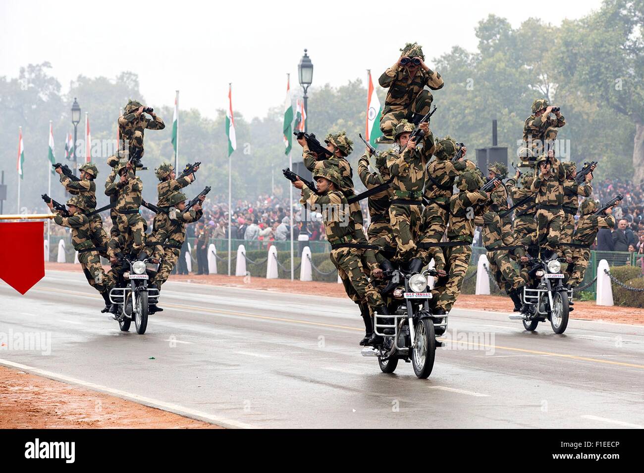 Members of the India's Border Security Force Dare Devils on motorcycles pass the review stand during the Republic Day Parade January 26, 2015 in New Delhi, India. Stock Photo