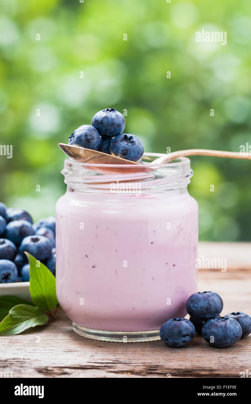 Fresh blueberries yogurt in glass jar Stock Photo