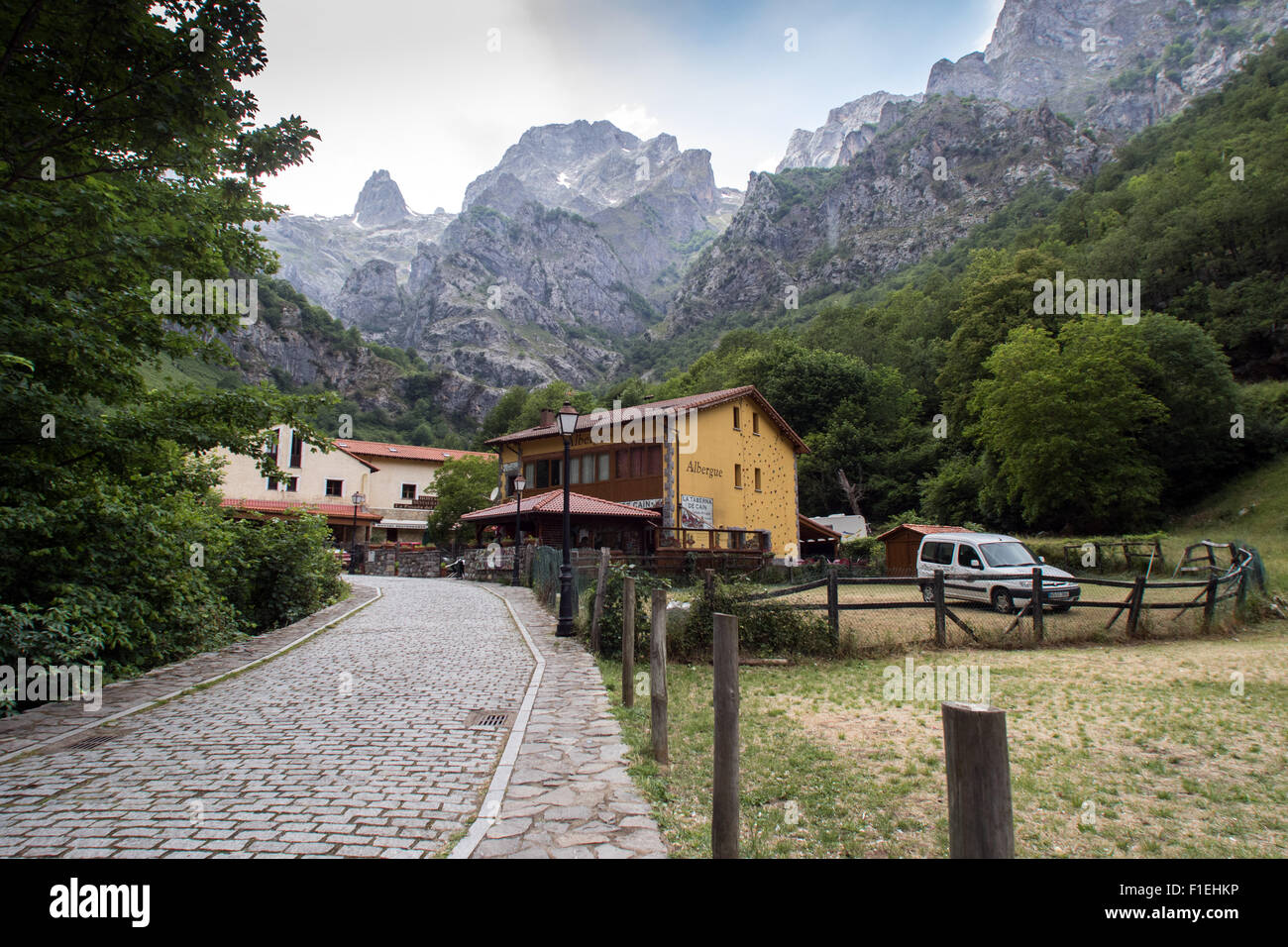 The Picos de Europa mountains tower above the village of Caín at the southern end of the Cares Gorge Stock Photo
