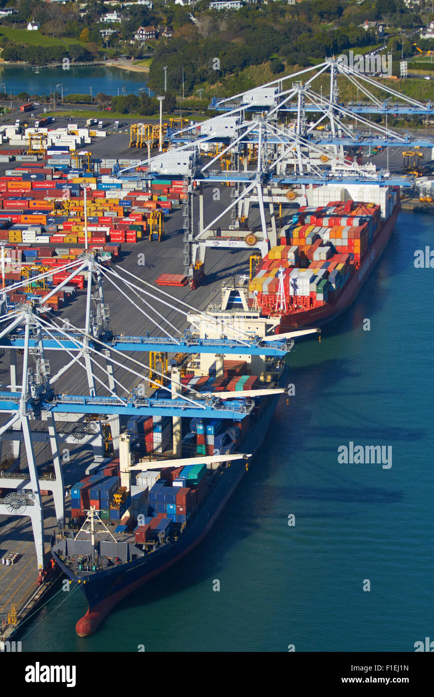 Ships and containers at Ports of Auckland, Auckland, North Island, New Zealand - aerial Stock Photo