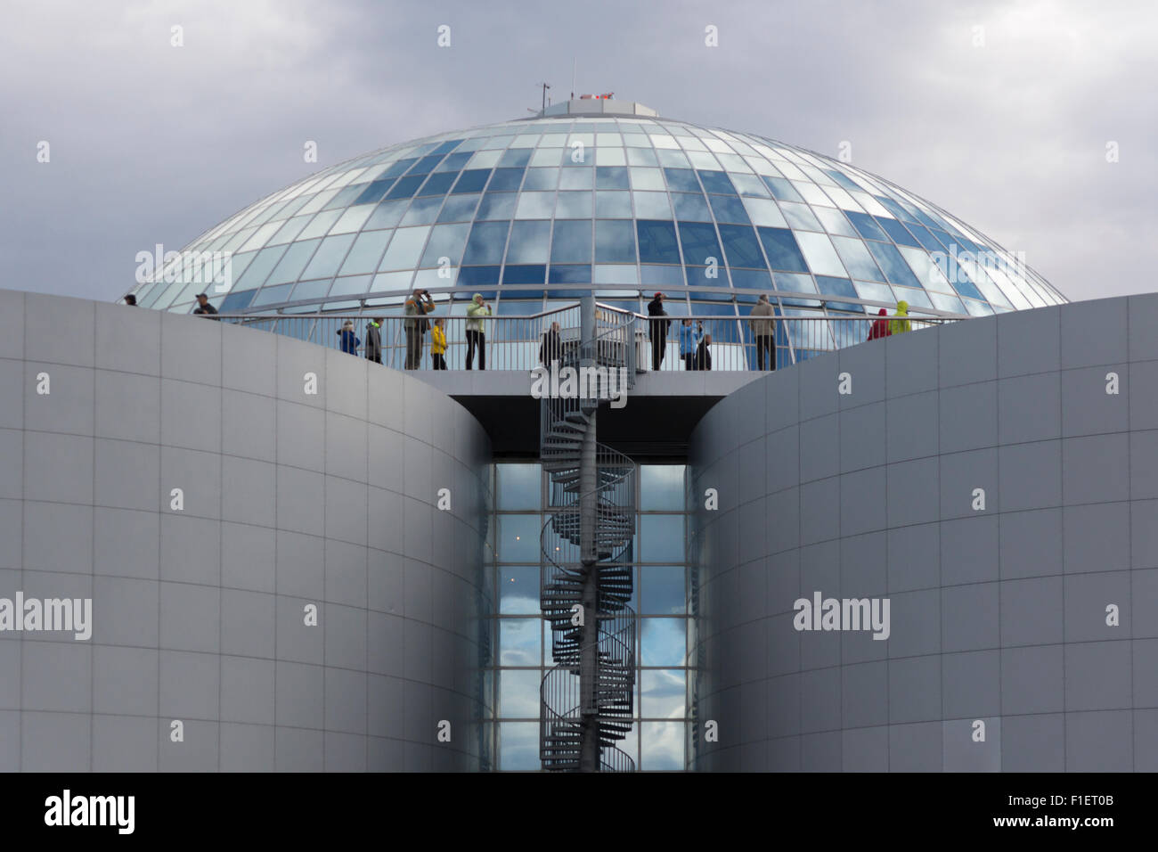 Shoppers and tourists looking out at the panoramic view at the top of Perlan, 'the Pearl' - a shopping centre and restaurant - in Reykjavik, Iceland Stock Photo