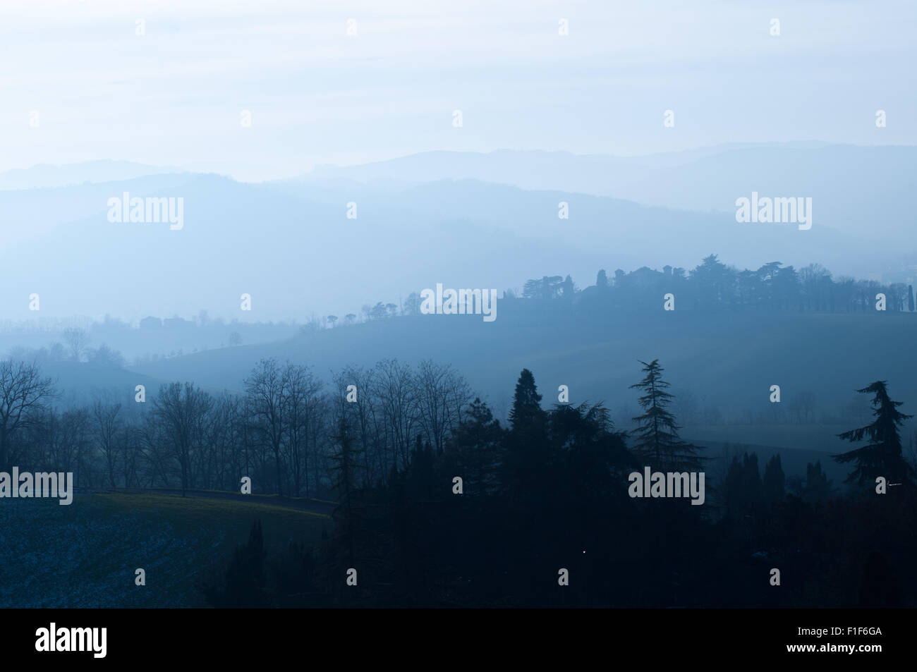 Hills of italy in a foggy day Stock Photo - Alamy