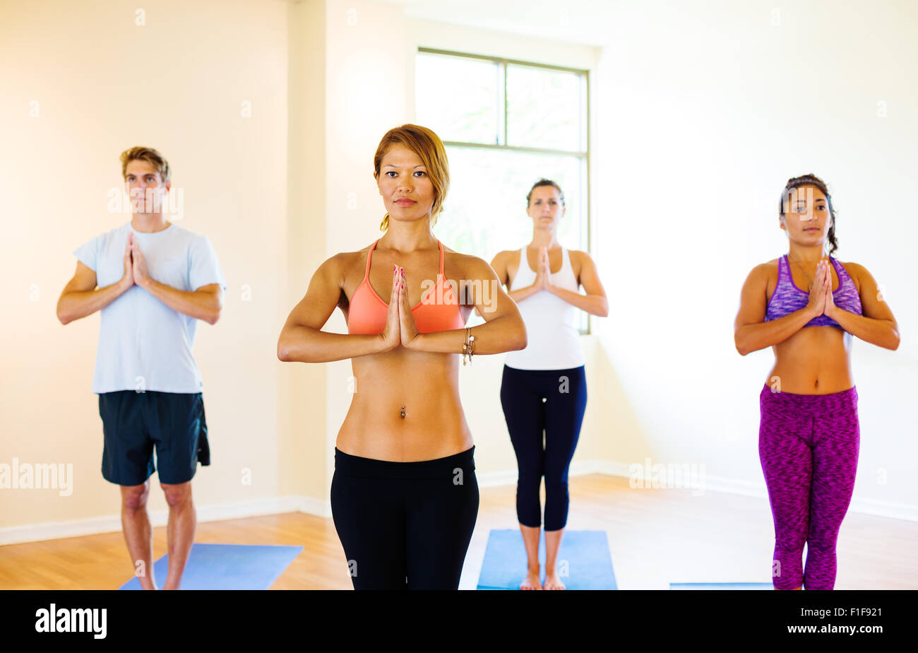 Group of Young People Relaxing Practicing Yoga, Healthy Lifestyle. Stock Photo