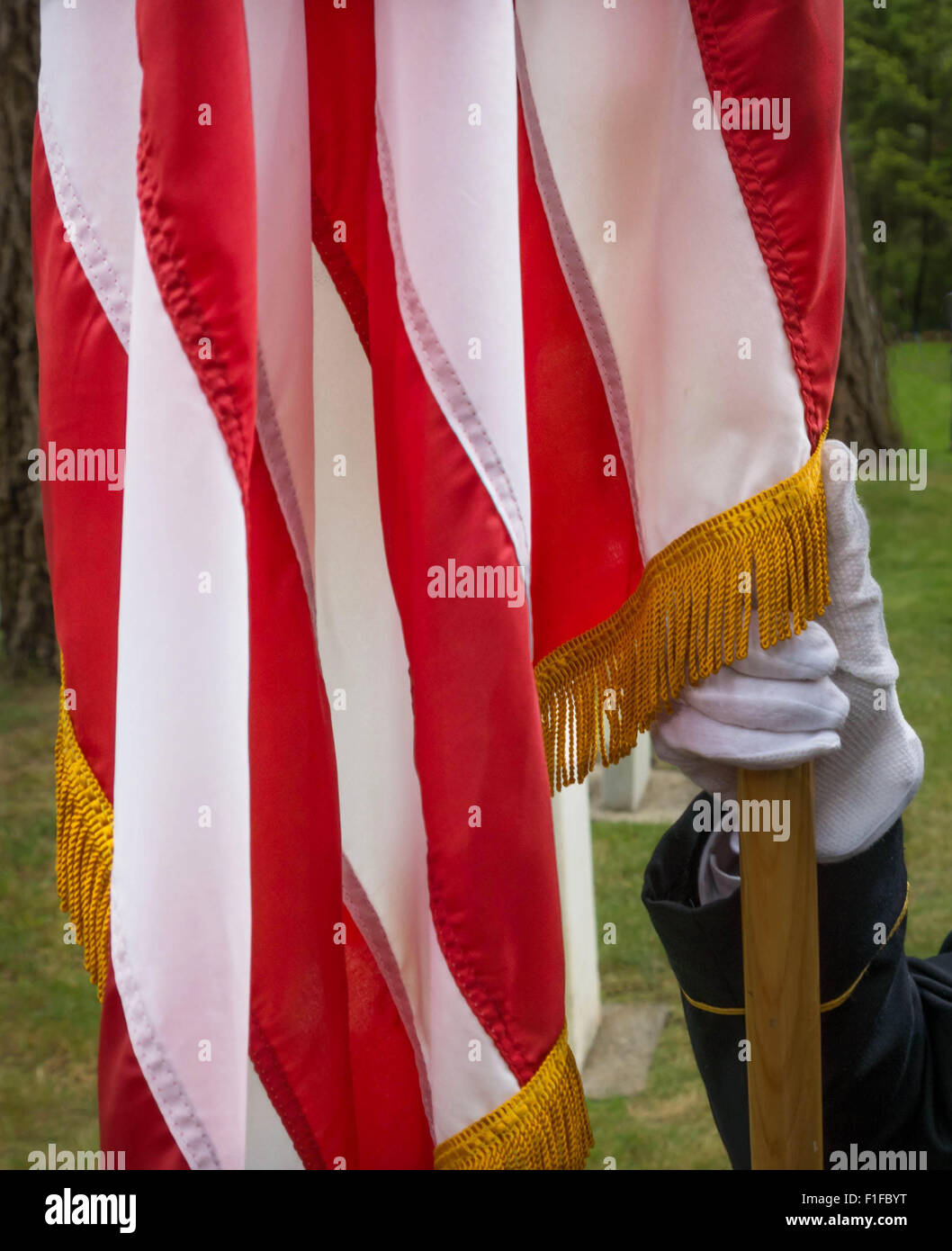 Military Honor Guard holding the staff of the American Flag at a Memorial Day ceremony. Stock Photo