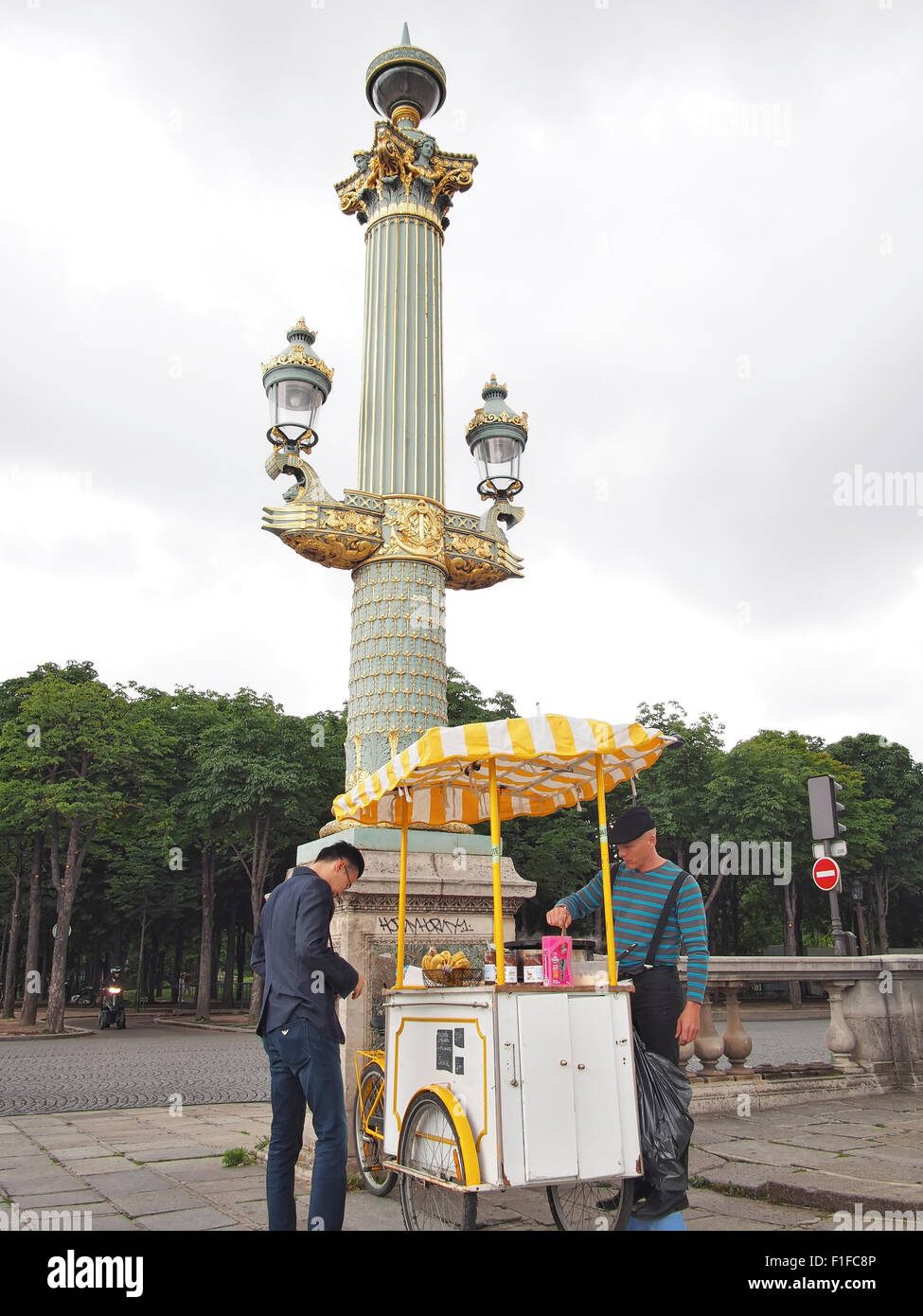 Paris, France, Europe - June 21, 2013: a man buying crepes from a crepes cart in Paris, France. Stock Photo
