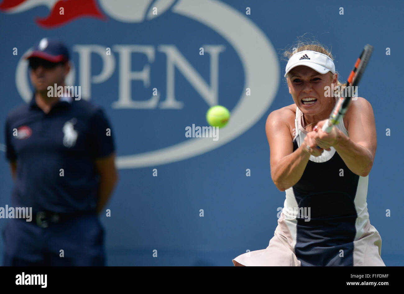 New York, USA. 1st Sep, 2015. Caroline Wozniacki of Denmark returns a shot to Jamie Loeb of the United States during their women's singles first round match at the 2015 US Open Tennis Tournament in New York, the United States, Sept. 1, 2015. Wozniacki won 2-0. © Bao Dandan/Xinhua/Alamy Live News Stock Photo