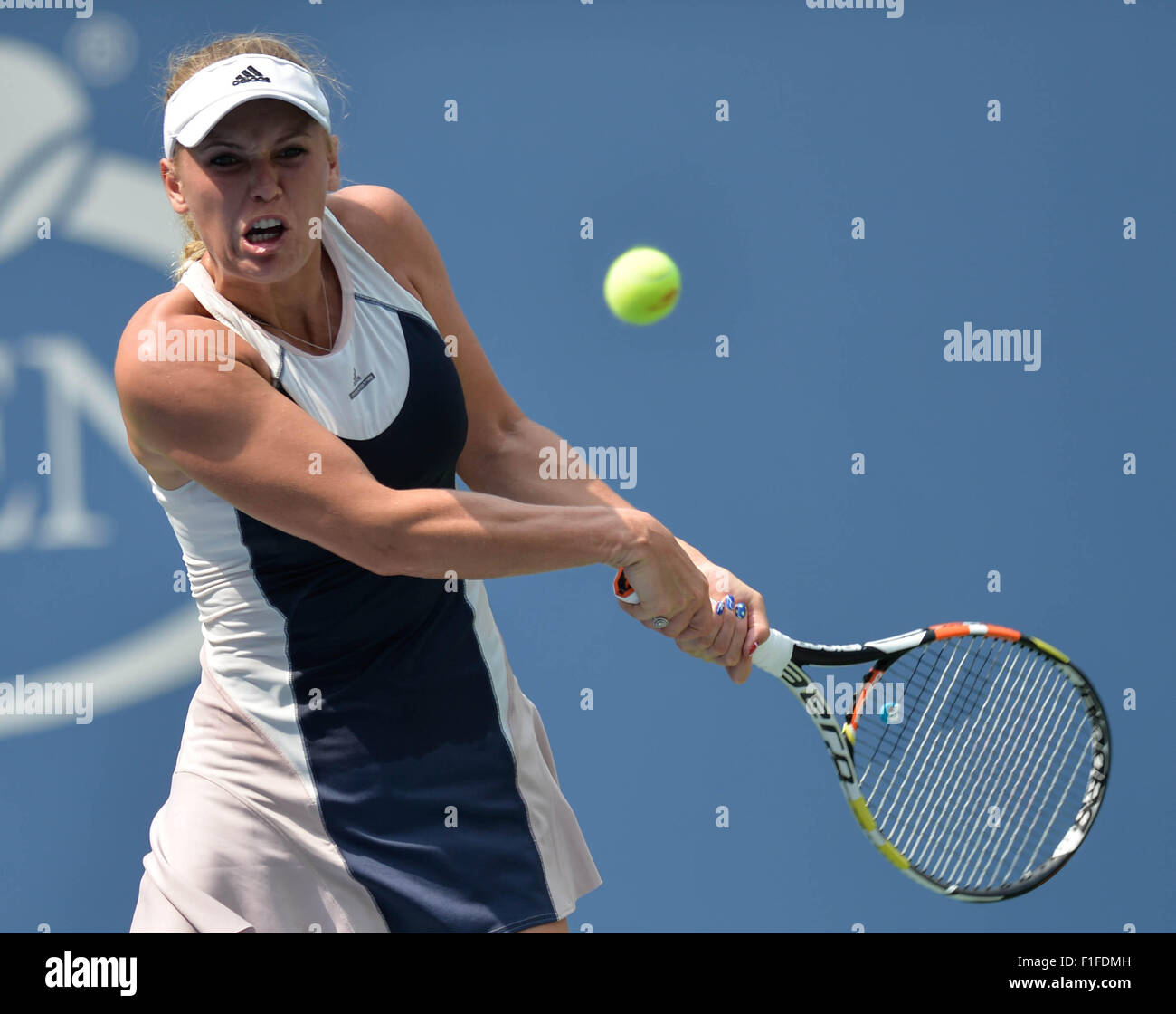 New York, USA. 1st Sep, 2015. Caroline Wozniacki of Denmark returns a shot to Jamie Loeb of the United States during their women's singles first round match at the 2015 US Open Tennis Tournament in New York, the United States, Sept. 1, 2015. Wozniacki won 2-0. © Bao Dandan/Xinhua/Alamy Live News Stock Photo