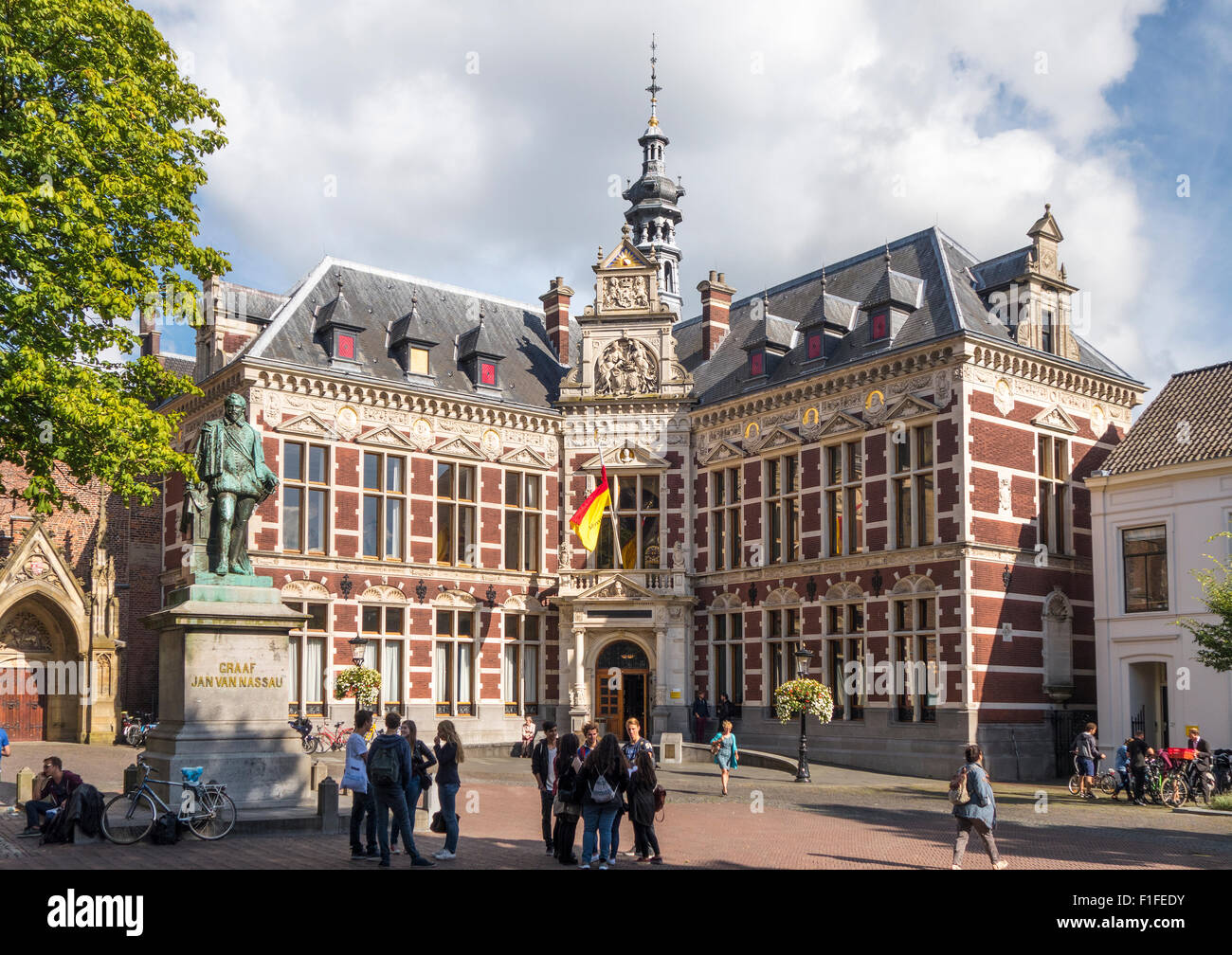 Utrecht University in Utrecht, Netherlands, with students. Academiegebouw Domplein, or Dom Square, the official main building. Stock Photo