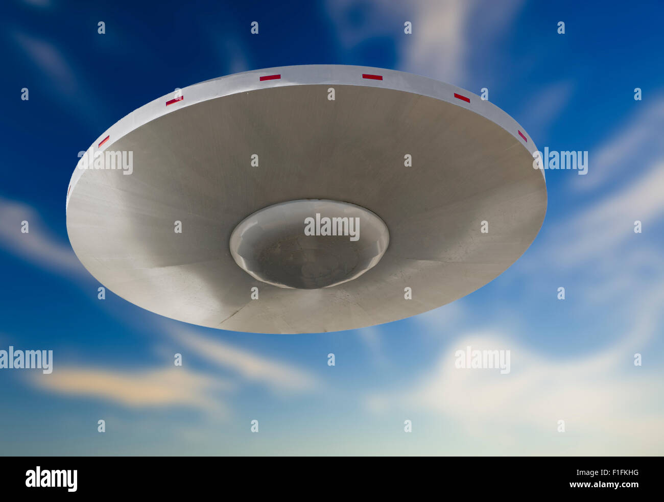 This UFO was created form a outdoor light fixture.The light pole was removed  in Photo shop. Stock Photo