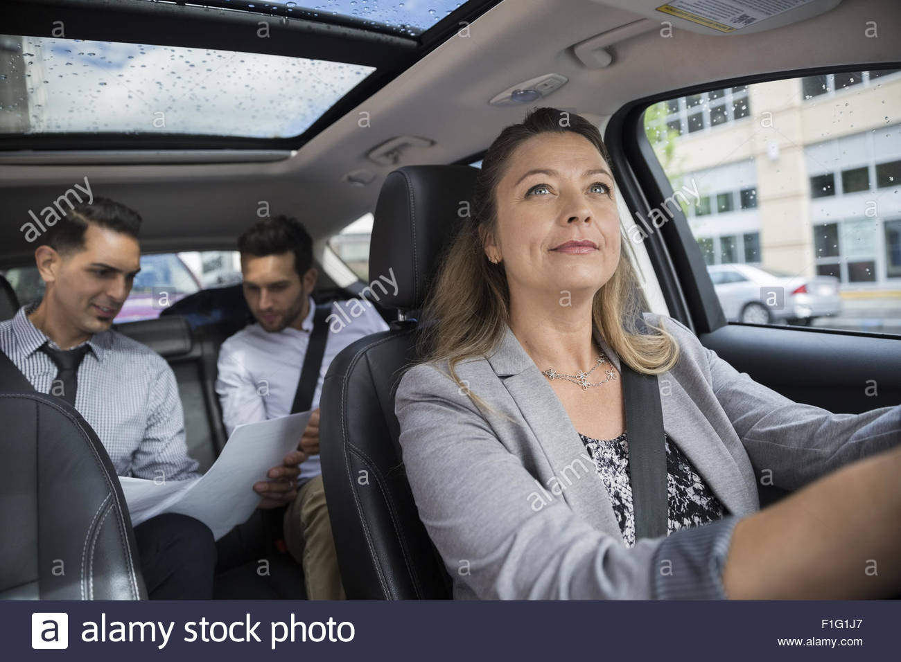 Business people carpooling in car Stock Photo
