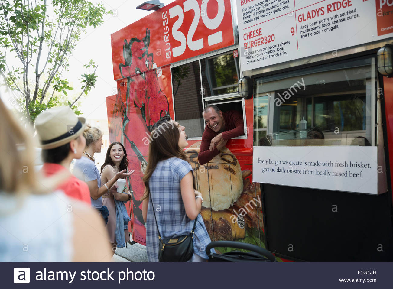 Customers ordering at food truck Stock Photo Alamy