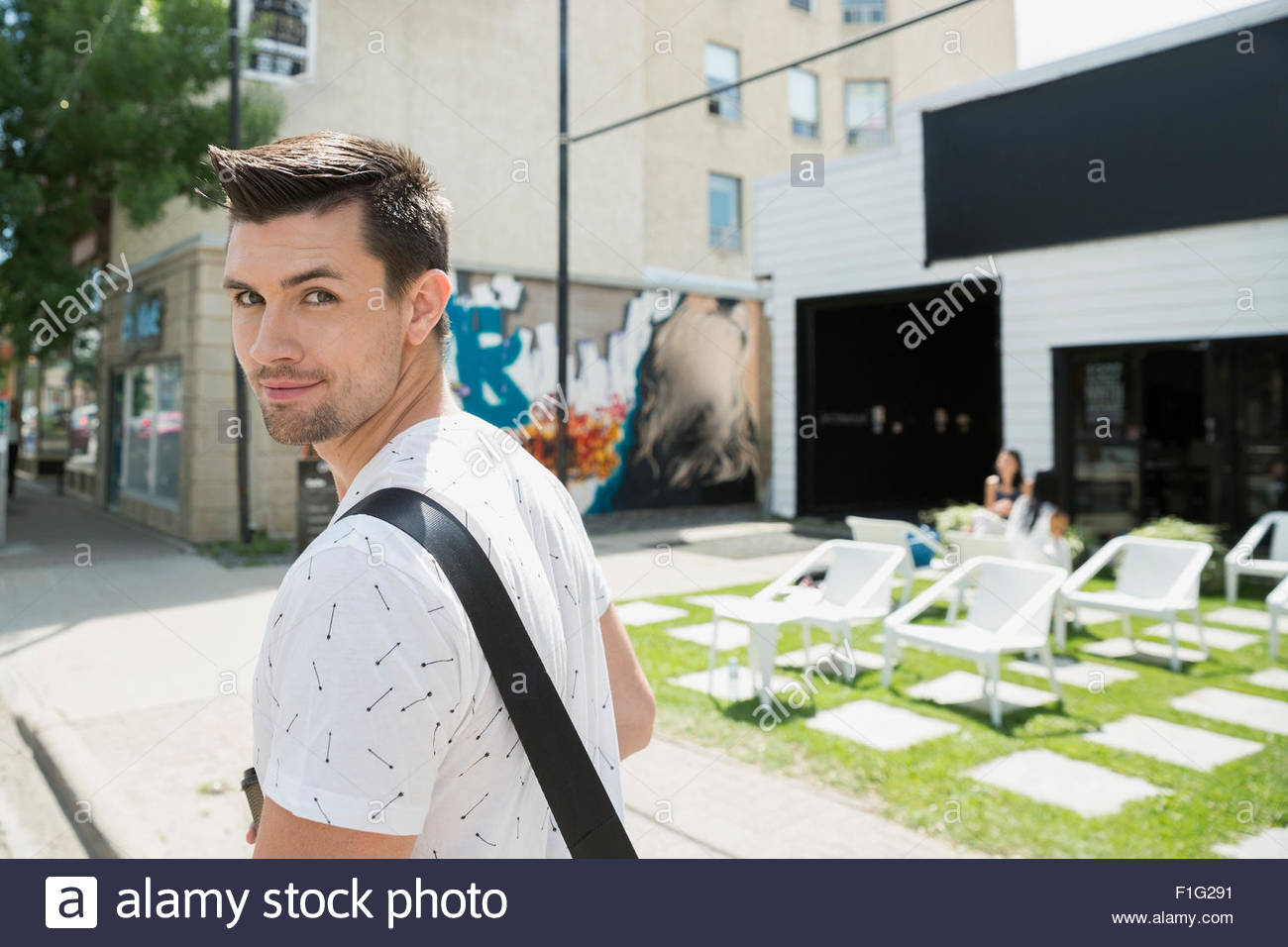 Portrait smiling man on urban street Stock Photo