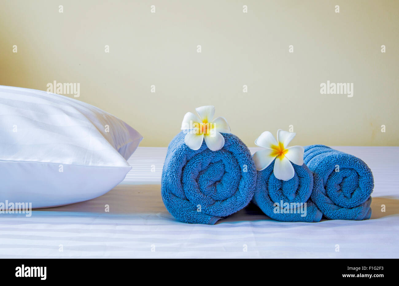 Well prepared in hotel bed with Frangipani flowers Stock Photo