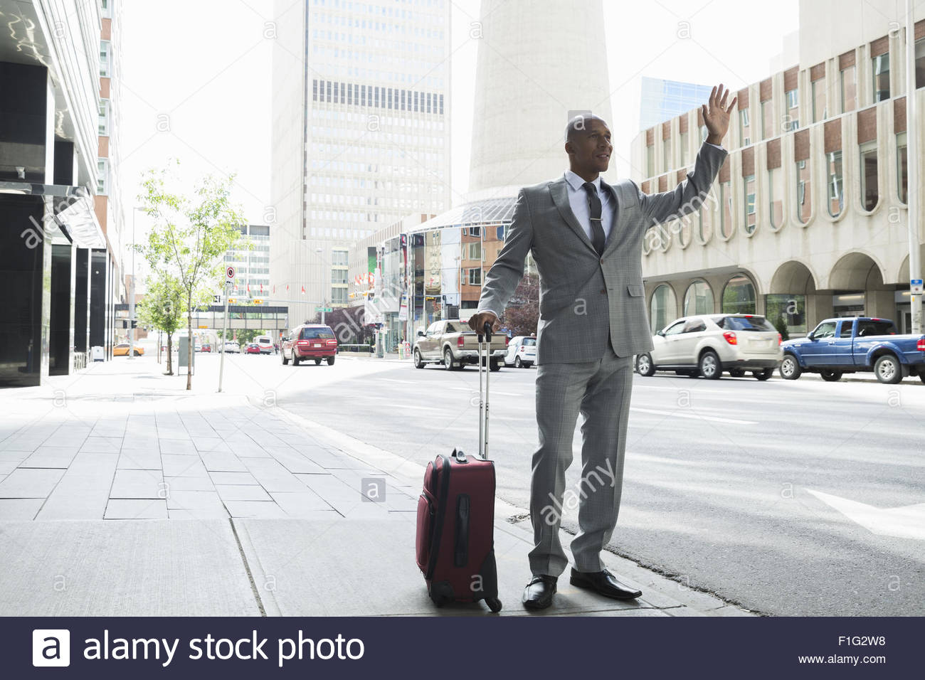 Hailing a taxi suitcase hires stock photography and images Alamy