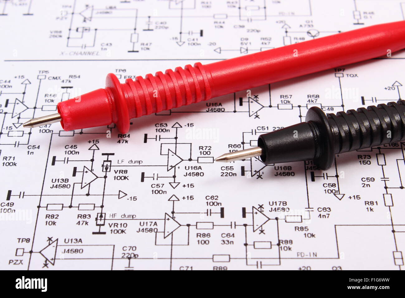 Cable of multimeter on diagram of electronics printed circuit board