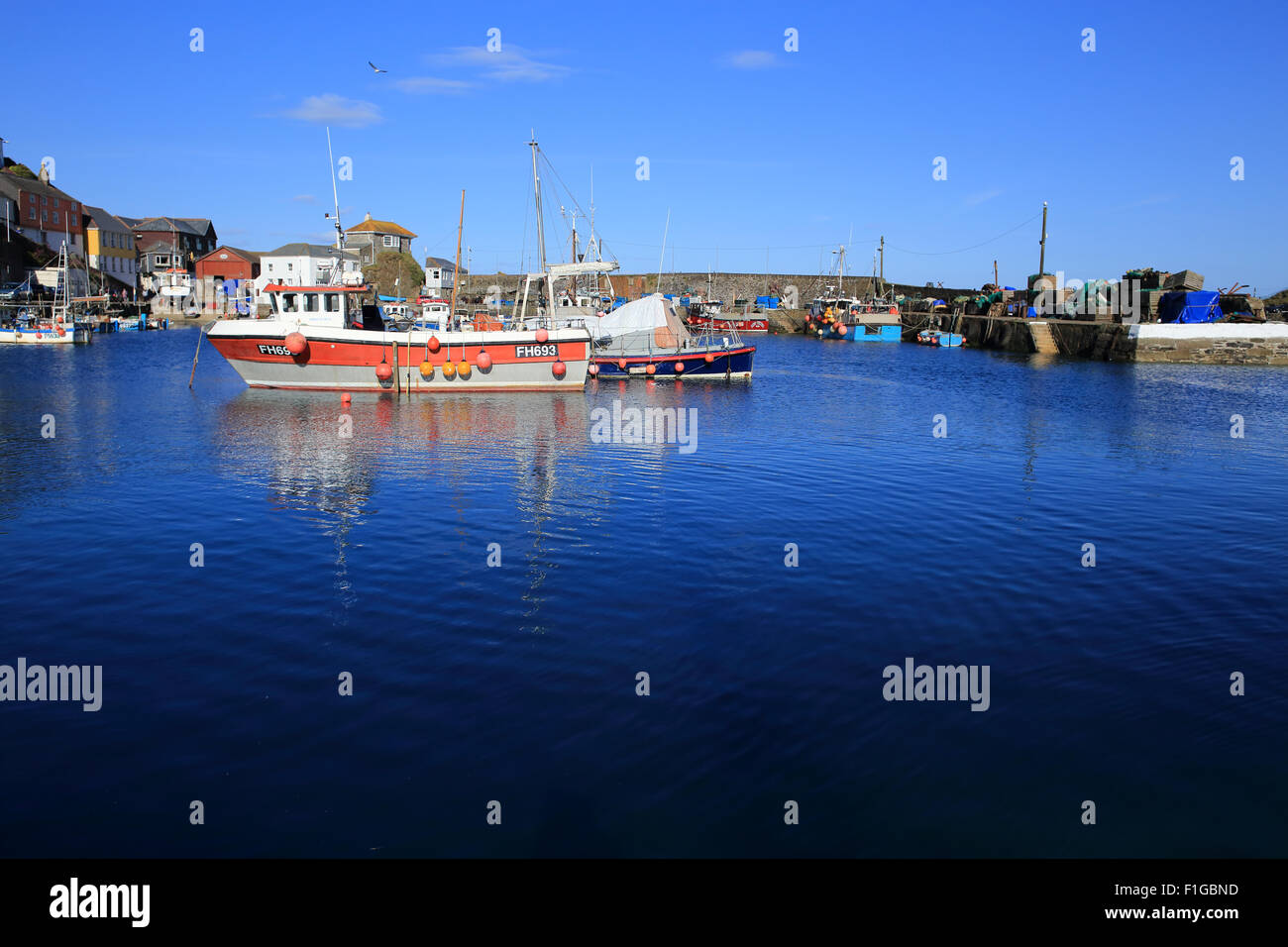 Fishing boats on a fine Spring day in the Inner Harbour of Mevagissey, Cornwall, England, UK. Stock Photo