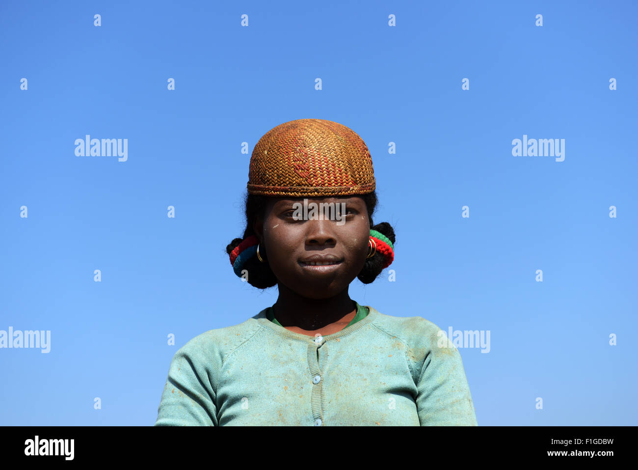 A betsileo woman wearing a traditional betsileo hat. Stock Photo