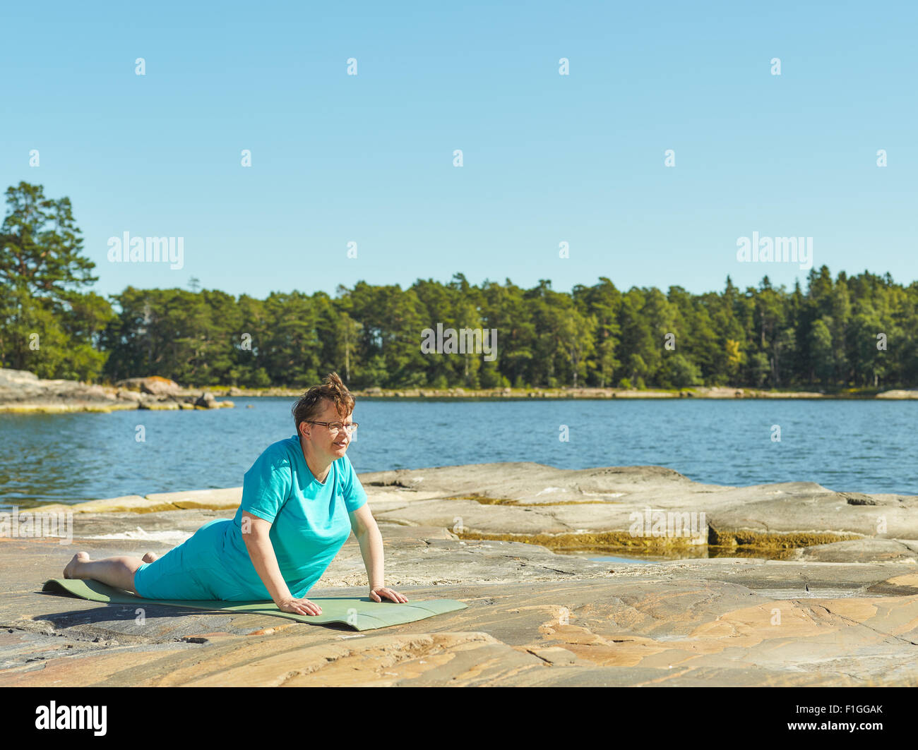 Real-life fitness training, mature woman training outdoor - horizon format image Stock Photo