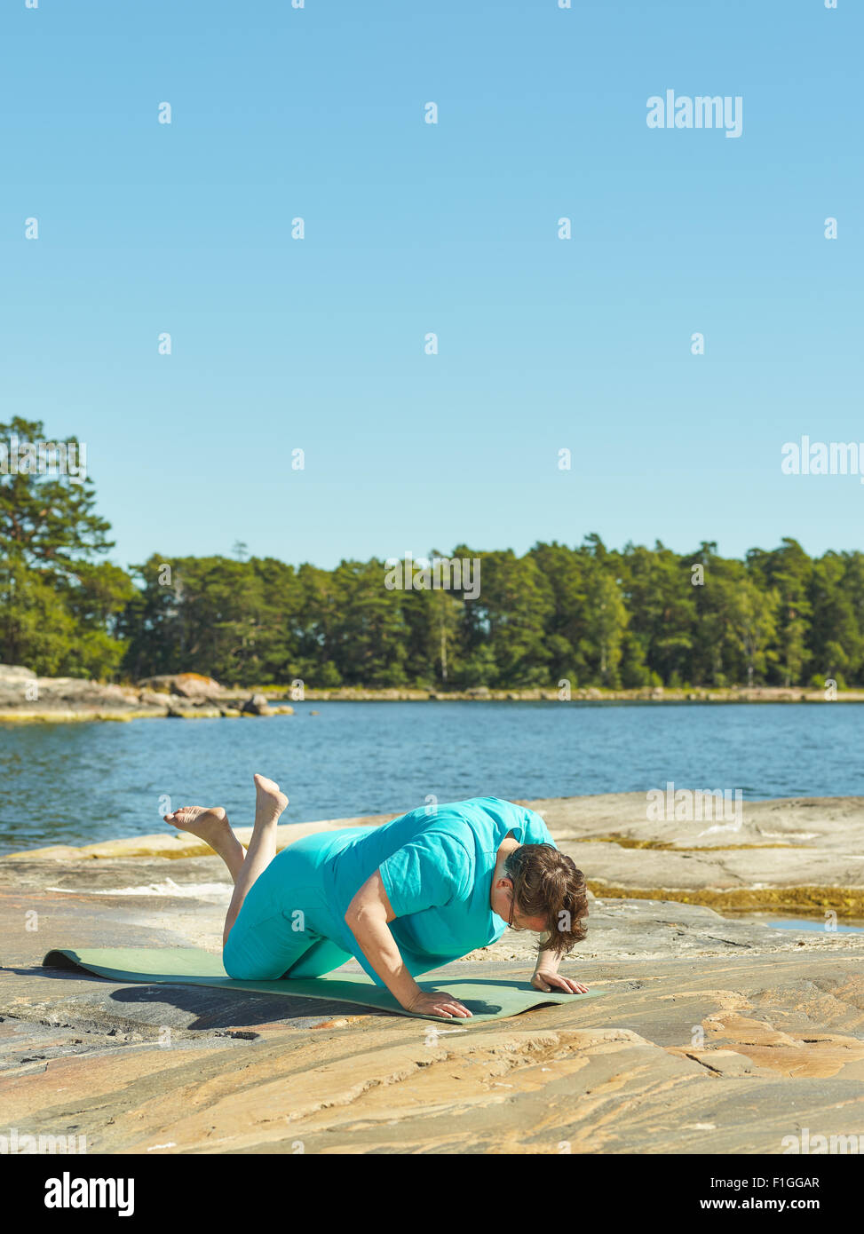 real-life-fitness-training-mature-woman-training-outdoor-vertical