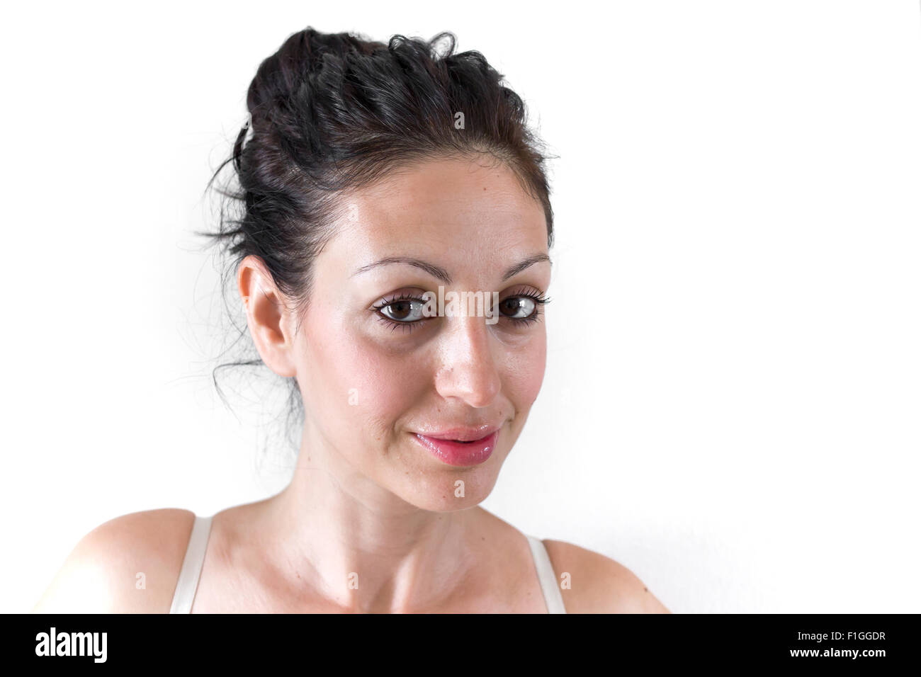 Close up of the face of a young woman with light skin and natural tones. Stock Photo