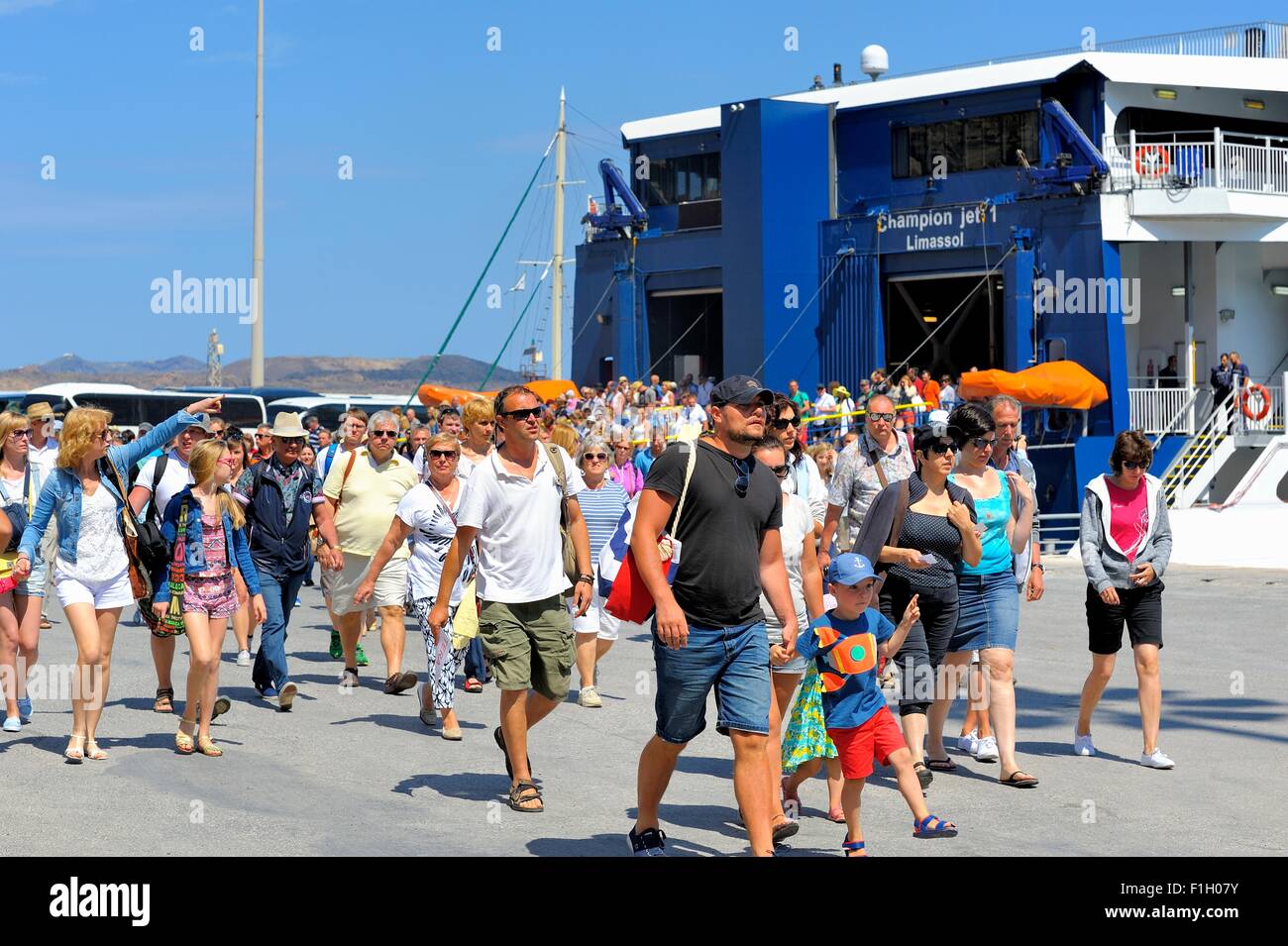 Ferry passengers arriving in the port of Ormos Athinios Santorini ...