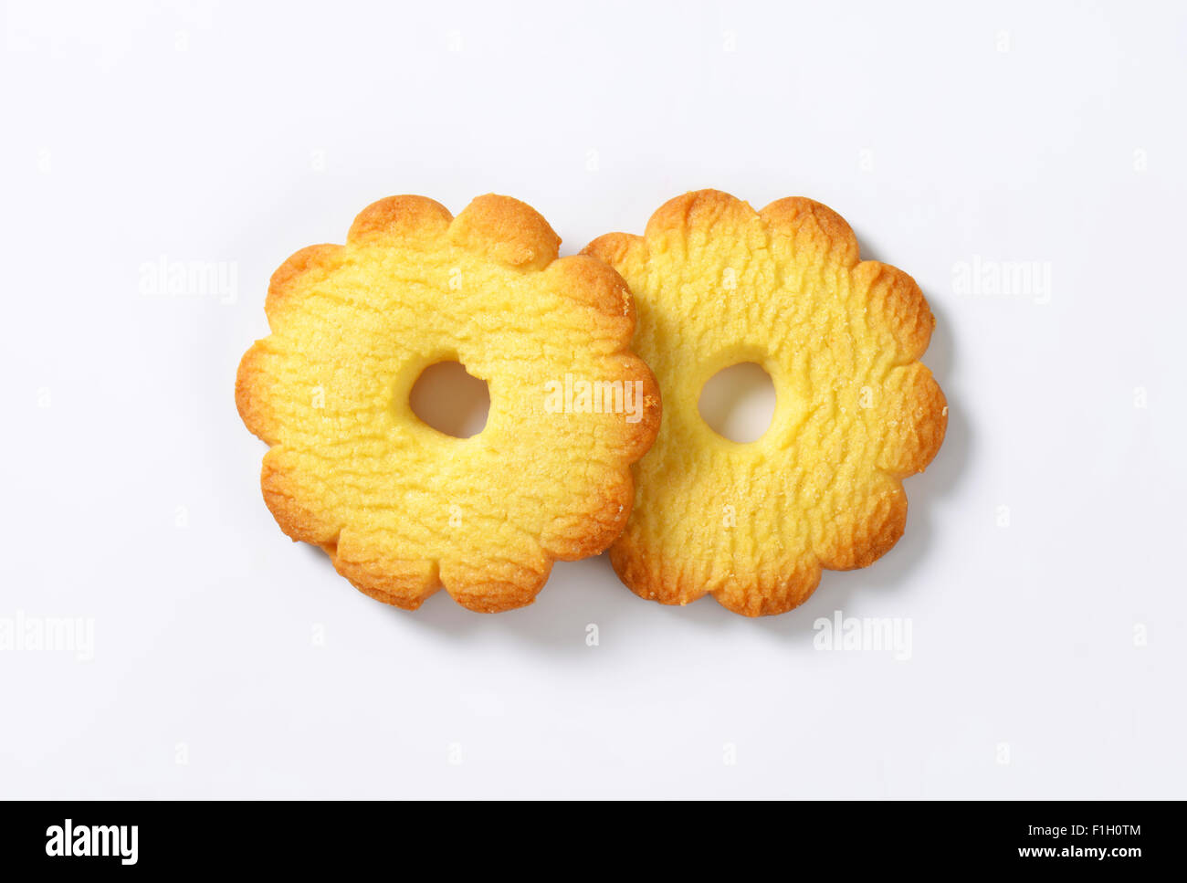 two italian butter cookies Canestrelli on white background Stock Photo