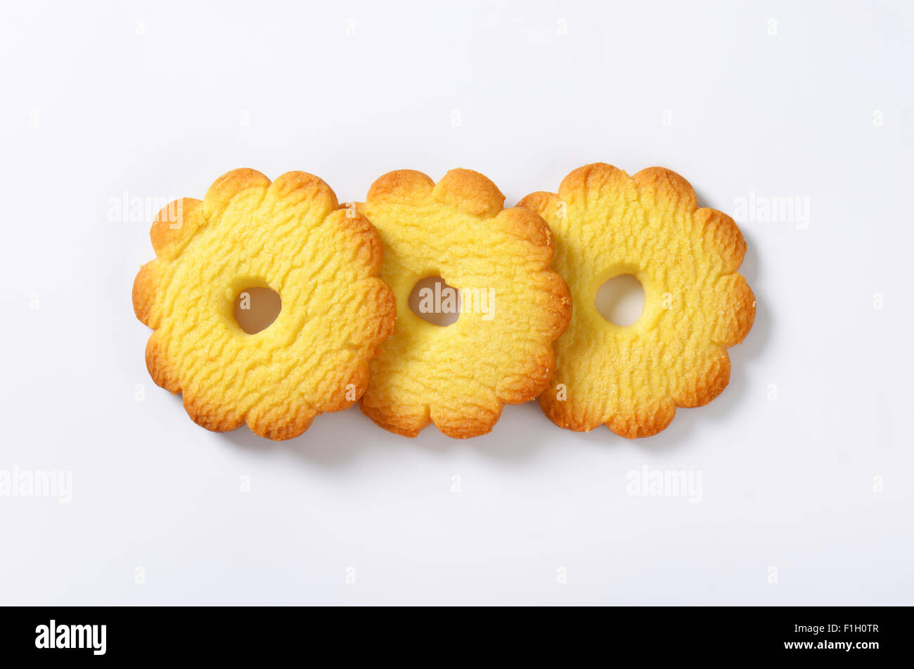 three italian butter cookies Canestrelli on white background Stock Photo