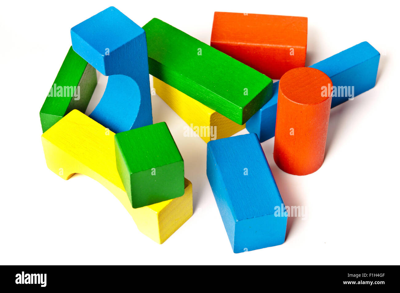 colourful wooden toy construction pieces Stock Photo