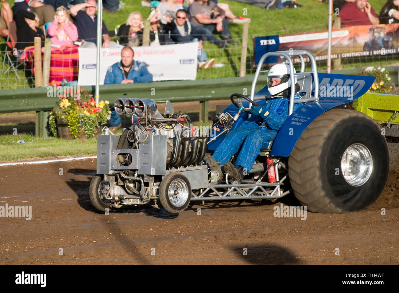 supercharged mini puller using a v8 rodeck chevy racing engine to compete in a tractor pull event Stock Photo