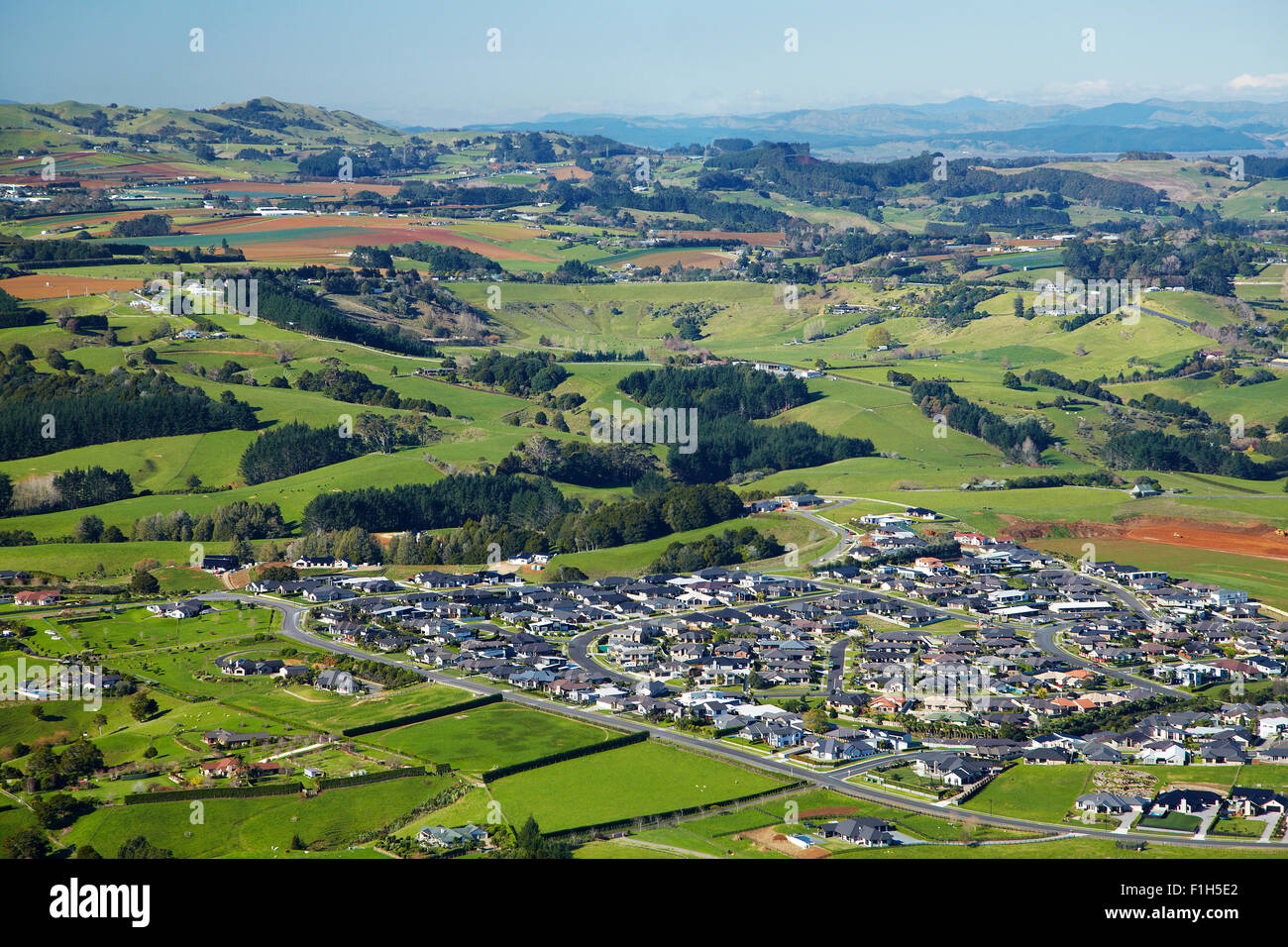 New housing development, Pukekohe, farmland, and Bombay Hills, South