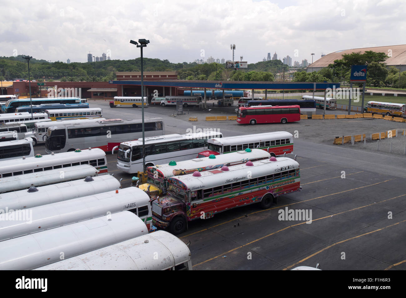 Bus terminal for tourists and travelers, gas station in Panama City, Central America. Skyline in background Stock Photo